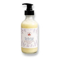 Frankincense Facial Wash in a clear glass bottle with a black pump dispenser and a white label featuring lavender illustrations, set against a plain white background.