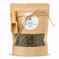 Kraft paper packaging of dried mullein with a wooden scoop and label on a white background